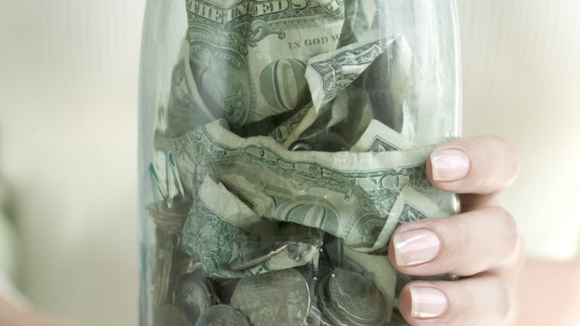 Jar of Money Jar of Money --- Image by © Royalty-Free/Corbis